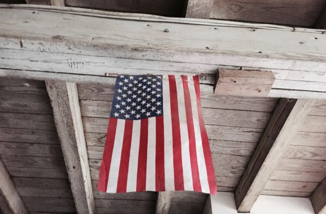 American flag hanging wooden ceiling