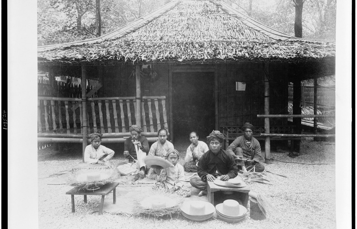 Title: Straw hat makers in Javanese Village seated before Javanese house, Paris Exposition, 1889 Abstract/medium: 1 photographic print : albumen.